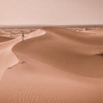 Tuareg walking on the soil desert
