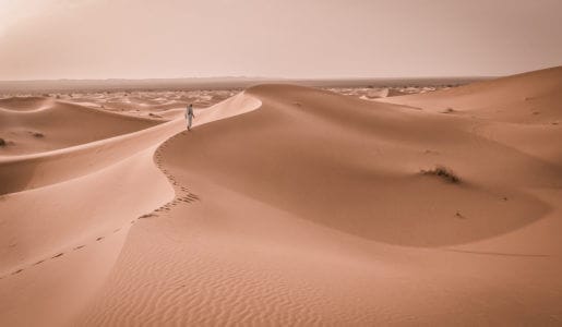 Tuareg walking on the soil desert