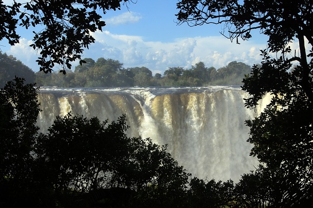 The Victoria Falls, one of the largest falls in the world, is located on the Zambezi River on the border between Zambia and Zimbabwe